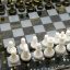 Шахматная доска с шахматами.